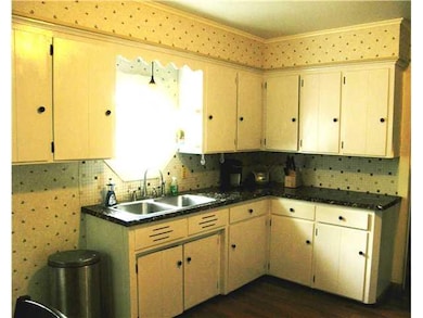Exterior Front. Freshly painted kitchen cabinets a