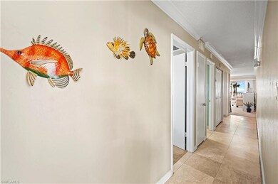 Hallway featuring ornamental molding
