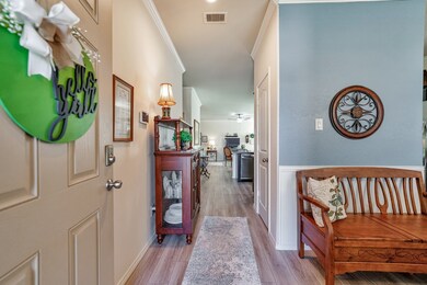 Entering the home, you are greeted with an elegant entry of high ceilings with crown molding, water resistant vinyl  plank flooring, and natural lighting.  Most furnishings are available for purchase.