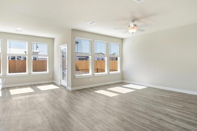 Empty room featuring visible vents, baseboards, w