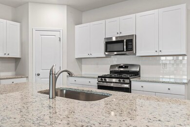 Kitchen with appliances with stainless steel finis