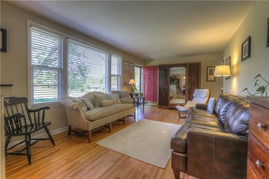 Living Room with Hardwoods and huge picture window.