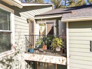View of home's exterior with a balcony