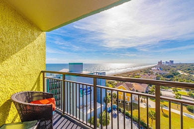 Balcony featuring a water view and a view of the b