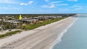 Birds eye view of property with a view of the beac