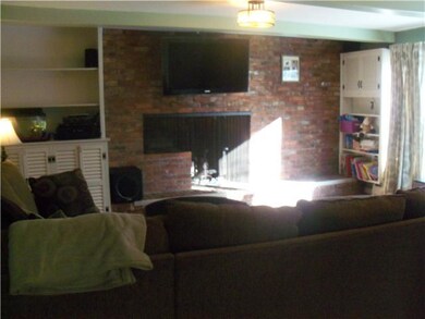 Family Room. Beautiful woodburning fireplace, hard
