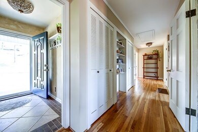 Wide hallway with wood floors.