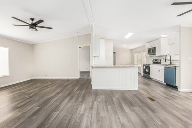 View from the secondary bedrooms towards the kitchen and the primary bedroom