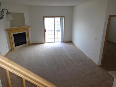 3. Large light filled main floor living room with gas burning fireplace.jpeg