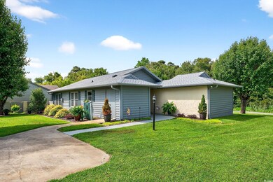 Ranch-style home with a front yard and roof with shingles