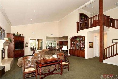 Large great room with vaulted ceilings and custom 