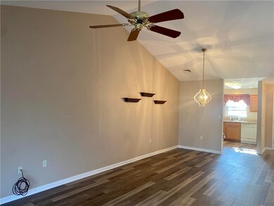 Open and Bright, Vaulted Ceiling makes this Living