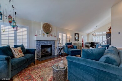 Formal living room features gas fireplace and an o