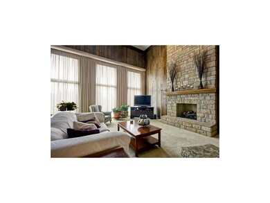 A bank of windows and tongue-and-groove paneling s