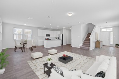 Living room with light wood finished floors, stai