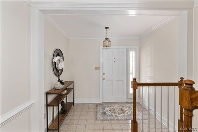 Entrance foyer featuring light tile flooring and c