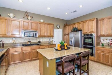 Open island kitchen with stainless appliances and 
