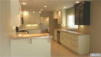 Updated kitchen with breakfast bar,window sink, li