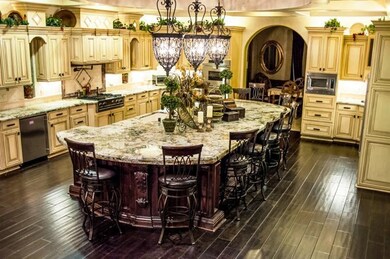 Gorgeous Custom cabinets, gas stove with pot fille