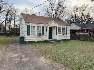 Bungalow-style home featuring a front yard and coo