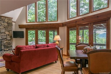 Wall of Windows for view of lake, mountains and de
