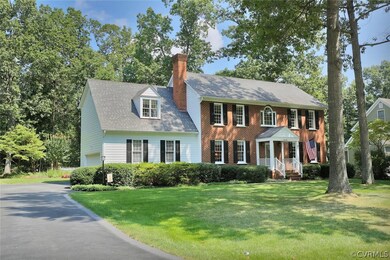 Double car garage and paved driveway with stamped