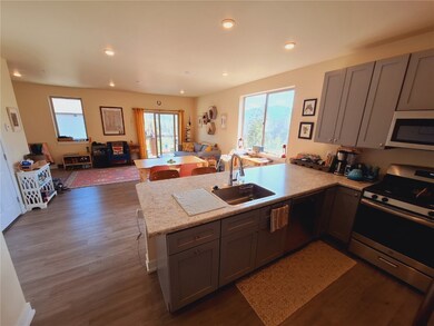 Kitchen featuring kitchen peninsula, stainless ste