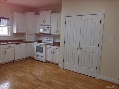 Kitchen showing large, double pantry closet