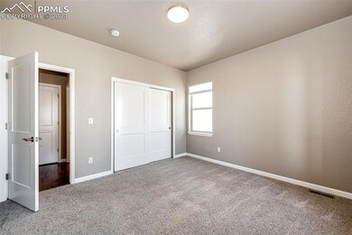 Unfurnished bedroom with a closet and carpet floor