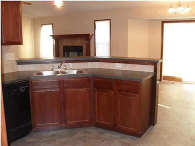 Kitchen features a raised breakfast bar
