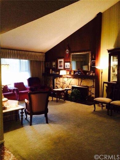 Living Room with Vaulted ceiling and fireplace