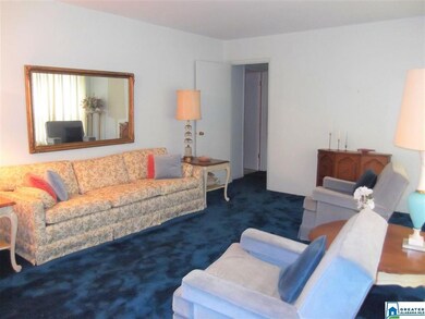 The living room appears to have hardwood flooring 