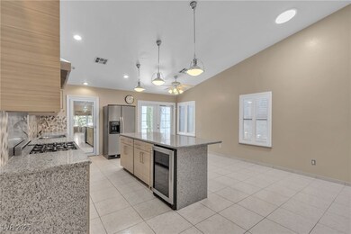 Kitchen with beverage cooler, french doors, stainl
