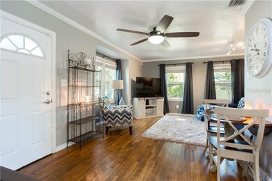Living/ Dining Room with original hardwood flooring
