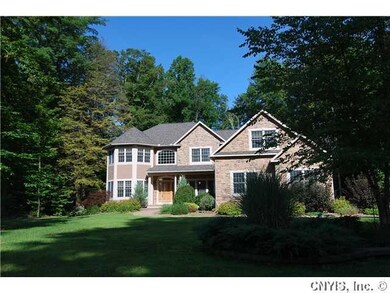 Exterior Front. Mature trees accent the beauty of 
