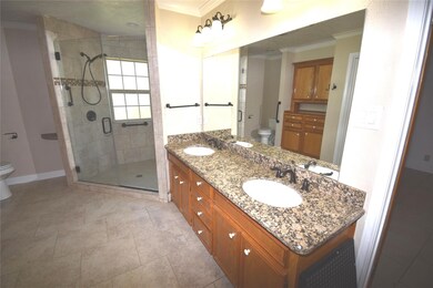 Master bathroom showing twin basins, granite count