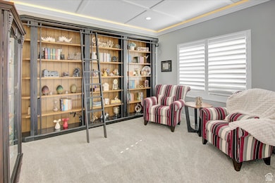 Office/Den or reception area with light colored carpet, recessed smart lighting, and coffered ceiling.