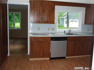 Kitchen Door leads to back family room and first f