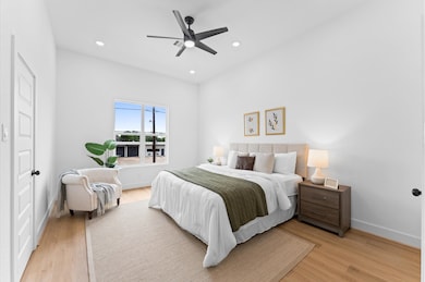 Under a high ceiling with recessed lighting, you'l
