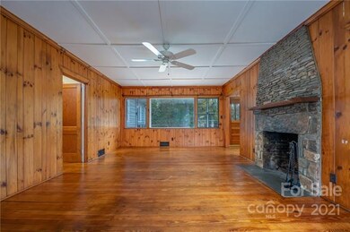 Living Room with stone fireplace.  Doorway on the 