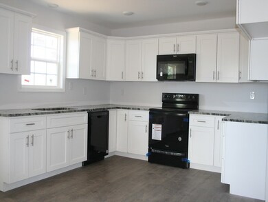 Lots of granite countertops, cabinets, and storage. Amana Appliance/Laminate floors.