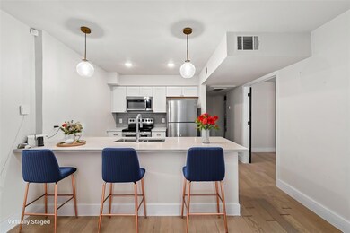 Kitchen with stainless steel appliances, a sink, 