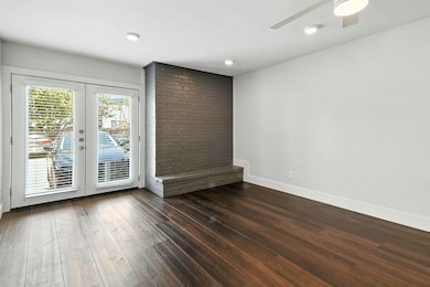 Spare room featuring dark wood finished floors, c