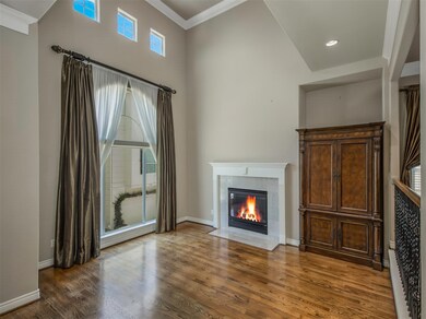 Second floor living space with high ceiling and to