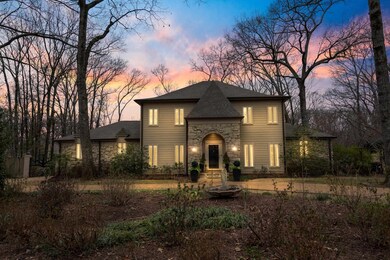 French provincial home featuring a shingled roof a