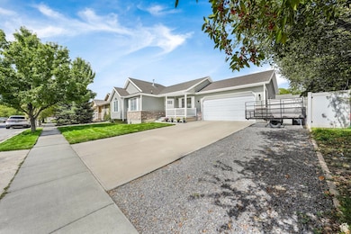 Ranch-style home featuring concrete driveway, an attached garage, a gate, and roof with shingles