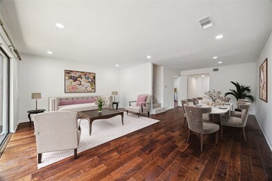 Spacious main living area with engineered wood flo