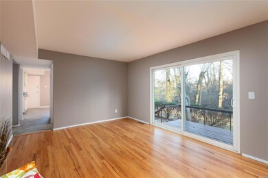 Another view of the Family Room looking out the Newer Sliding Glass Doors to the Deck area which walks out to the patio and large, private yard. What a wonderful view year round! This also peeks into the Kitchen!
