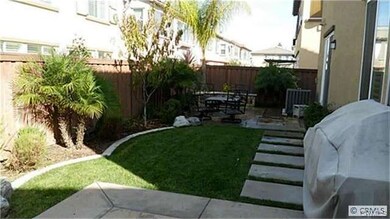Backyard with Fruit Trees and small Herb Garden