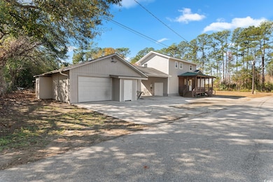 View of garage and entry to efficiency apartment